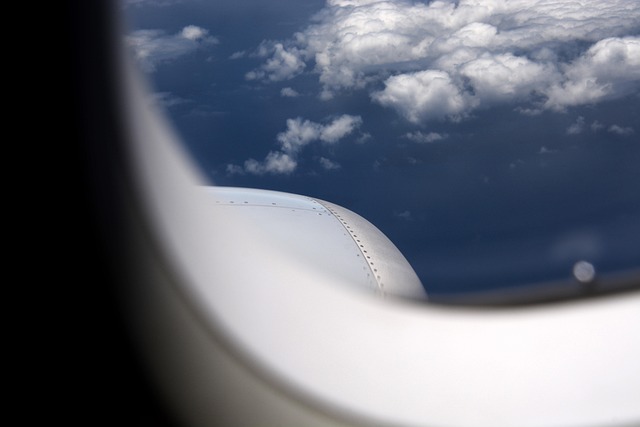 Airplane in sky flying to Palawan Philippines El Nido travel options