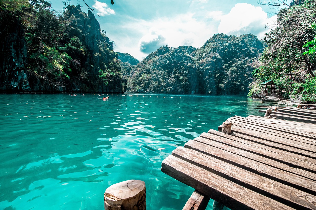 Tourists swimming in Kayangan Lake Coron Palawan Philippines