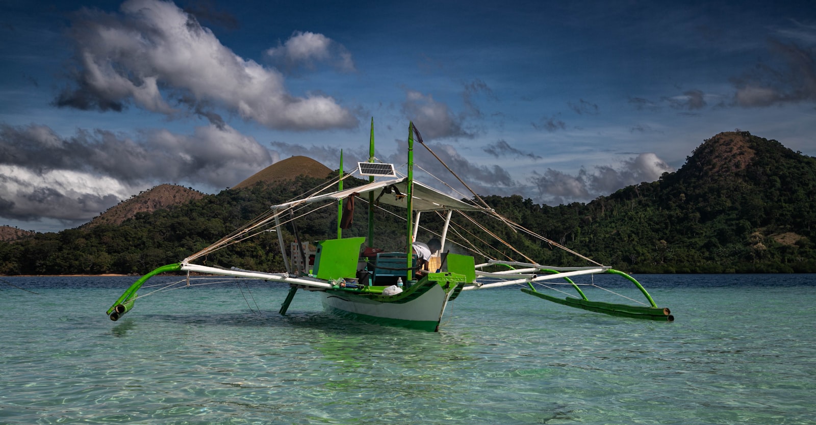 Traditional outrigger banca boat crossing to Balabac island Palawan Philippines