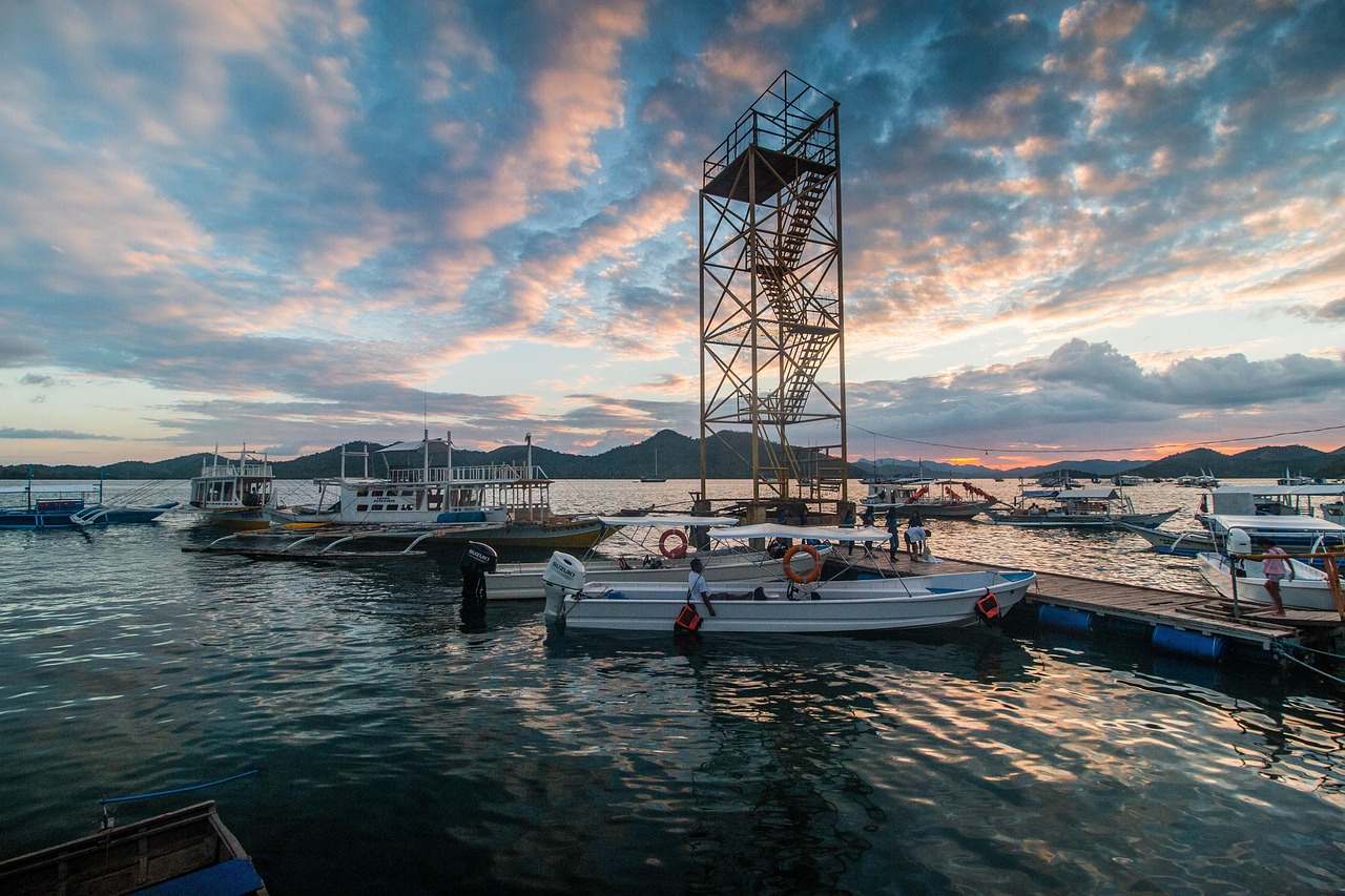Coron town harbor at sunset with bangka boats Palawan Philippines
