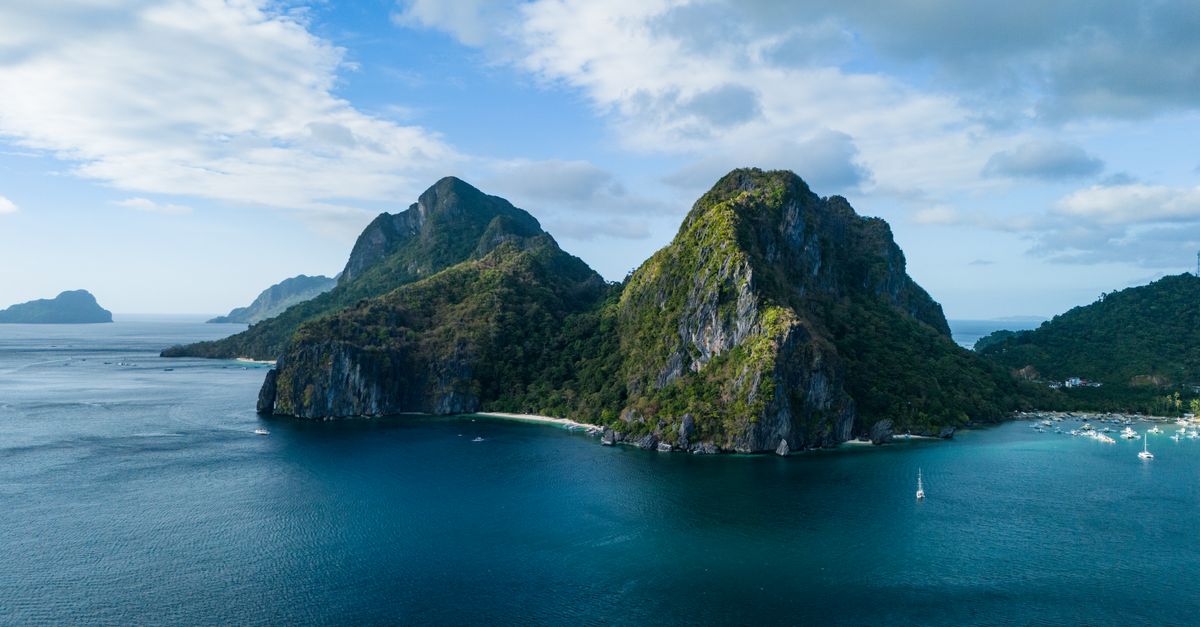 Aerial view of karst peaks over Bacuit Bay near Big Lagoon El Nido Palawan