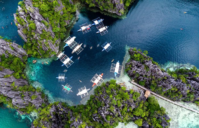 Aerial view of El Nido Palawan lagoon and boats, near the town where the best restaurants in El Nido are found