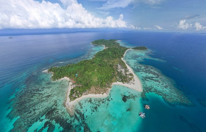 Aerial view of a coral reef and turquoise water in El Nido, Palawan, where reef-safe sunscreen matters most