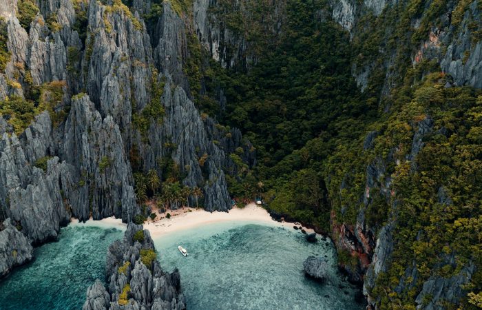 Turquoise lagoon cove with limestone cliffs on El Nido Tour A, Bacuit Bay Palawan