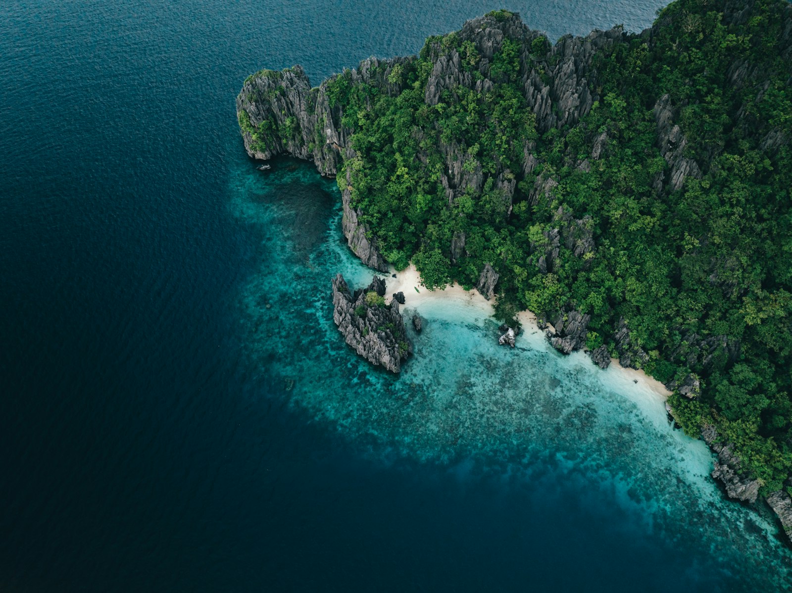 Limestone island with white sand beach in El Nido, Palawan, near Tour B's Snake Island stop