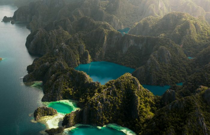 Aerial view of Barracuda Lake Coron surrounded by limestone karst cliffs in Palawan