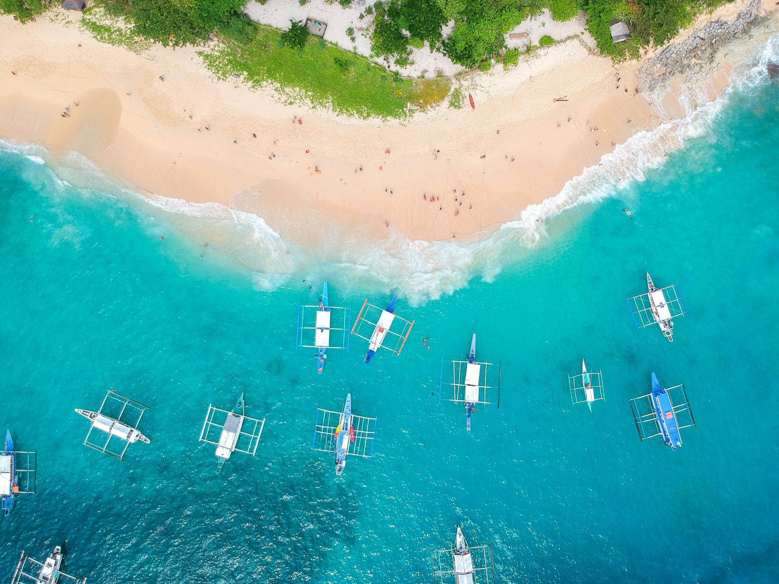 Boats near Helicopter Island, El Nido, reachable by private van and boat transport