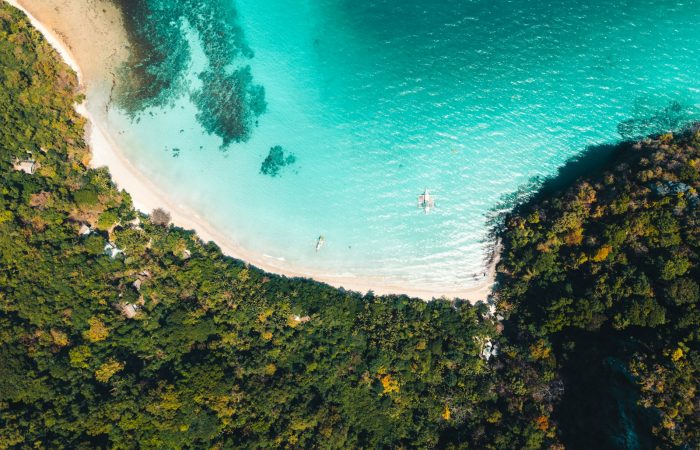 Aerial view of El Nido, Palawan coastline covered by private van hire routes