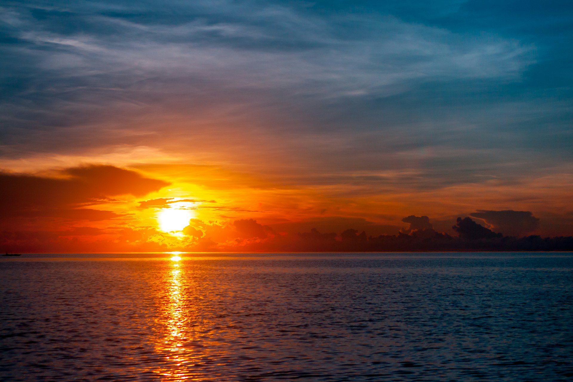 Dramatic sunset over the water in Palawan, the nightly view from Port Barton accommodation on the bay