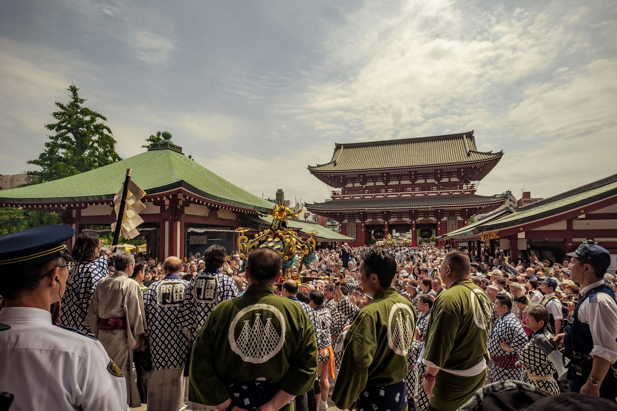 Crowds at Sanja Matsuri in Tokyo, one reason spring is a busy time to visit Japan