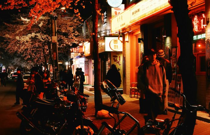 Seoul street at night under cherry blossoms, spring is the best time to visit South Korea for many