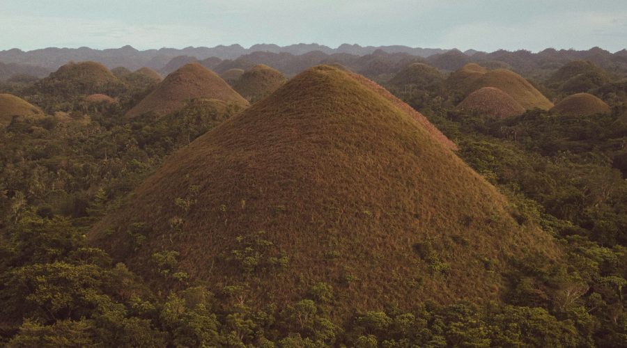 The Chocolate Hills of Bohol under a cloudy sky The Chocolate Hills of Bohol under a cloudy sky