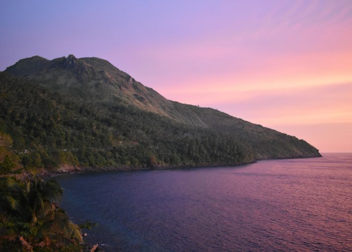 Water and green hills on Camiguin Island