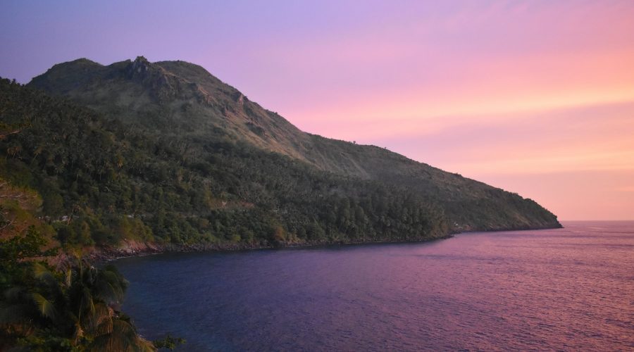 Camiguin coast and hills Water and green hills on Camiguin Island