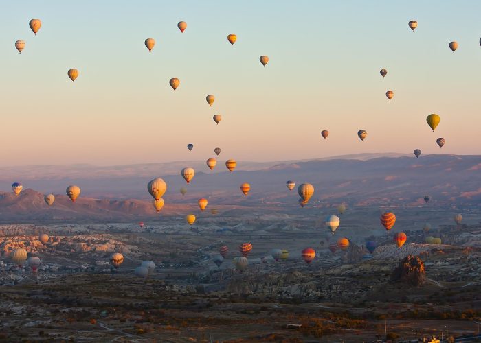 Hot air balloons over the rock formations of Cappadocia, Turkey