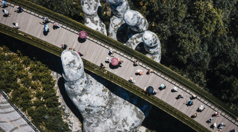 Golden Bridge held up by giant stone hands at Ba Na Hills, Da Nang
