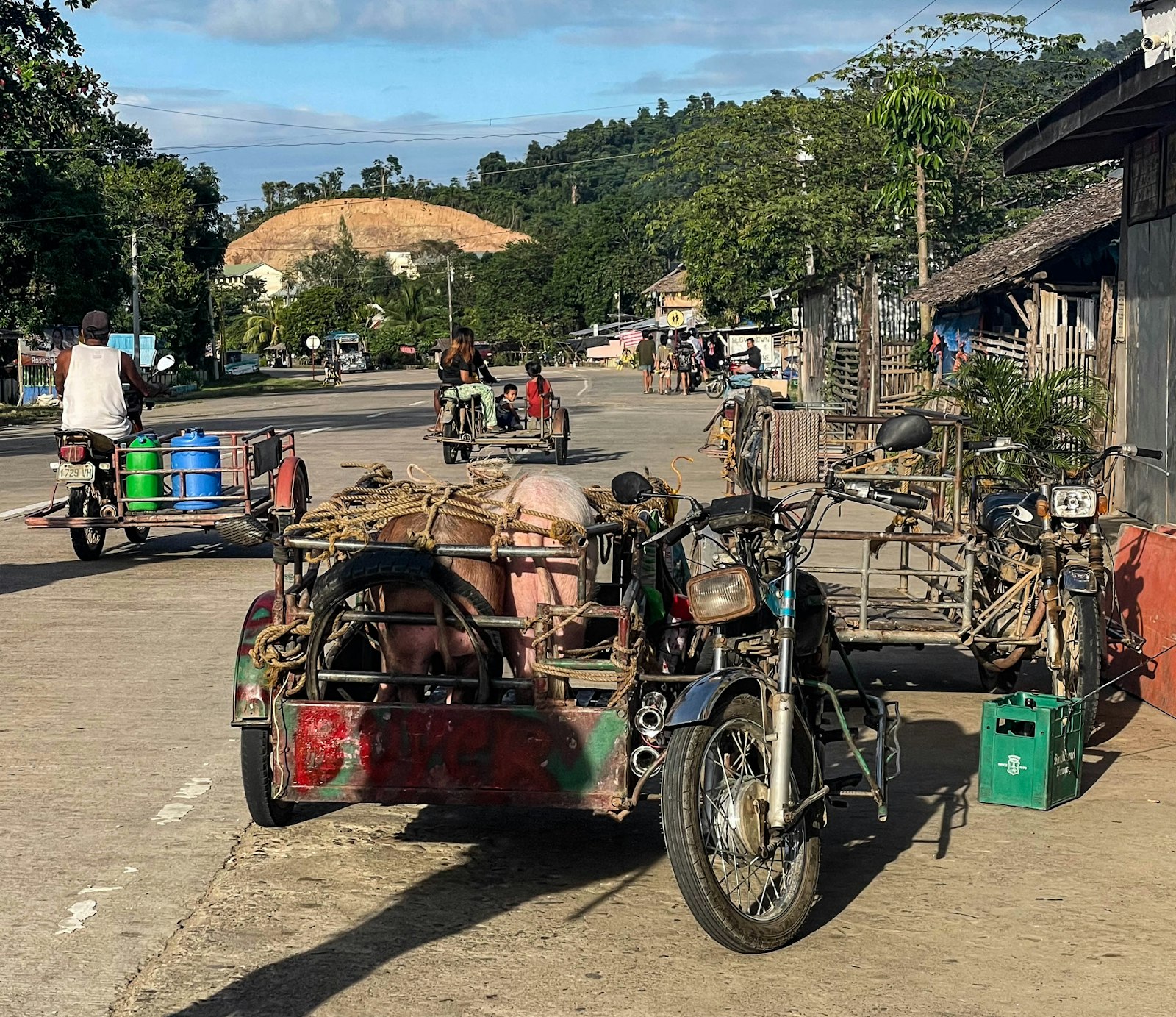 Motorbikes on a village road in Barotuan, El Nido, local transport that keeps your El Nido budget per day down