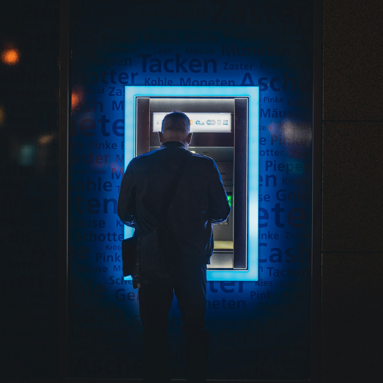 Traveller withdrawing cash at an ATM before heading to Palawan island destinations