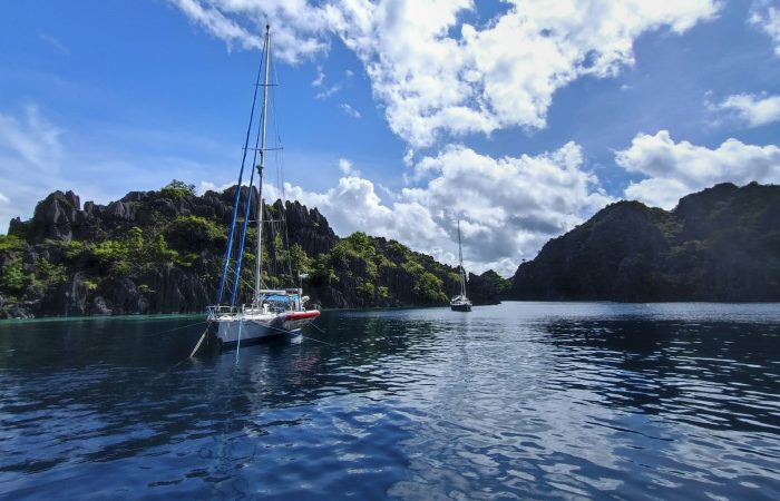 Boat crossing open water in Coron on a Palawan ferry route in Palawan Philippines