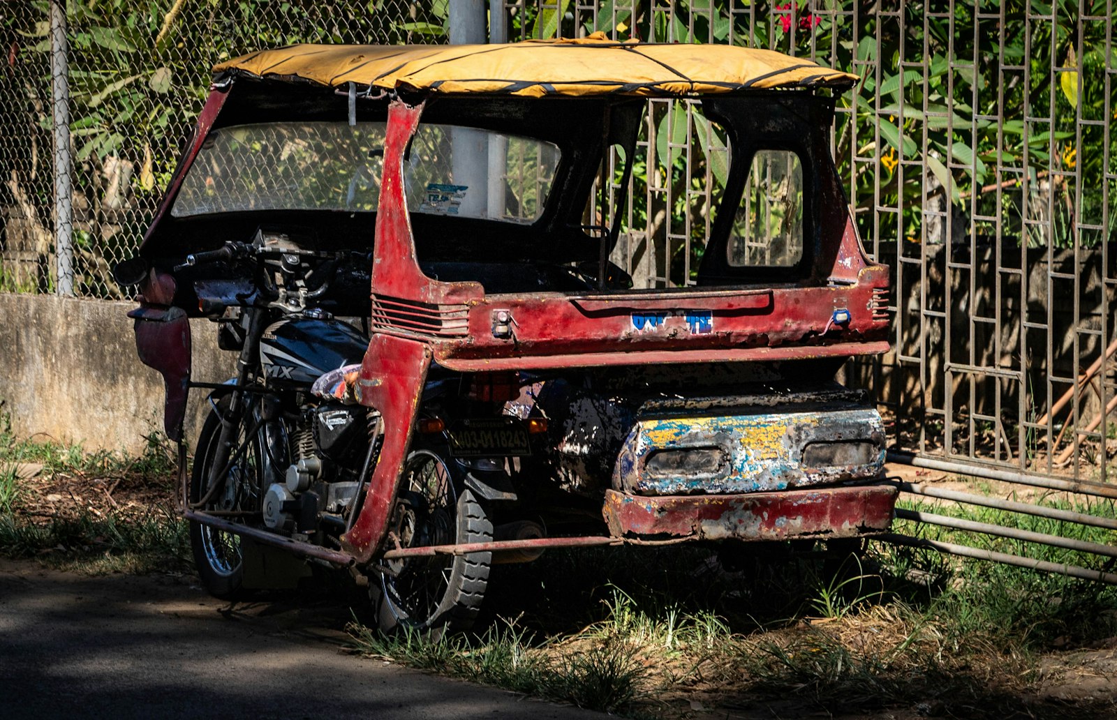 Red tricycle taxi in Puerto Princesa Palawan, a common ride to the Palawan Wildlife Rescue Center