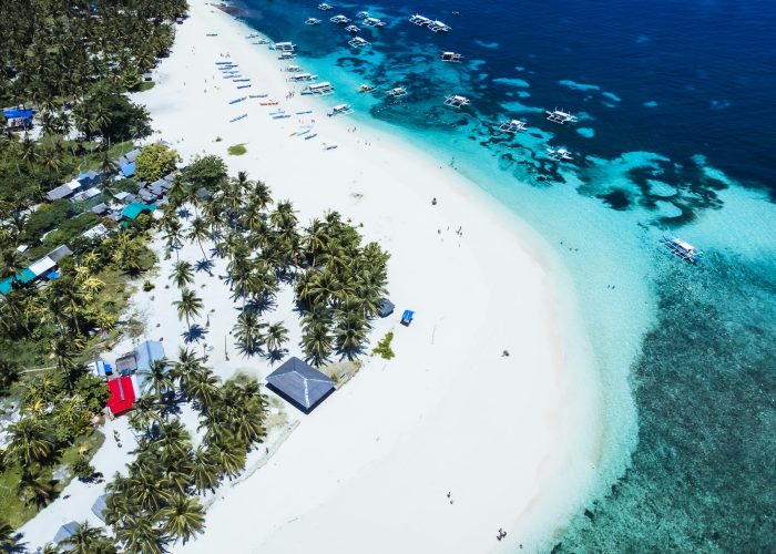 Aerial view of a Siargao island with white sand