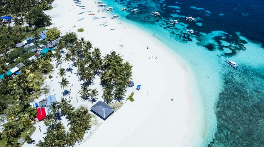 Aerial view of a Siargao island with white sand Aerial view of a Siargao island with white sand