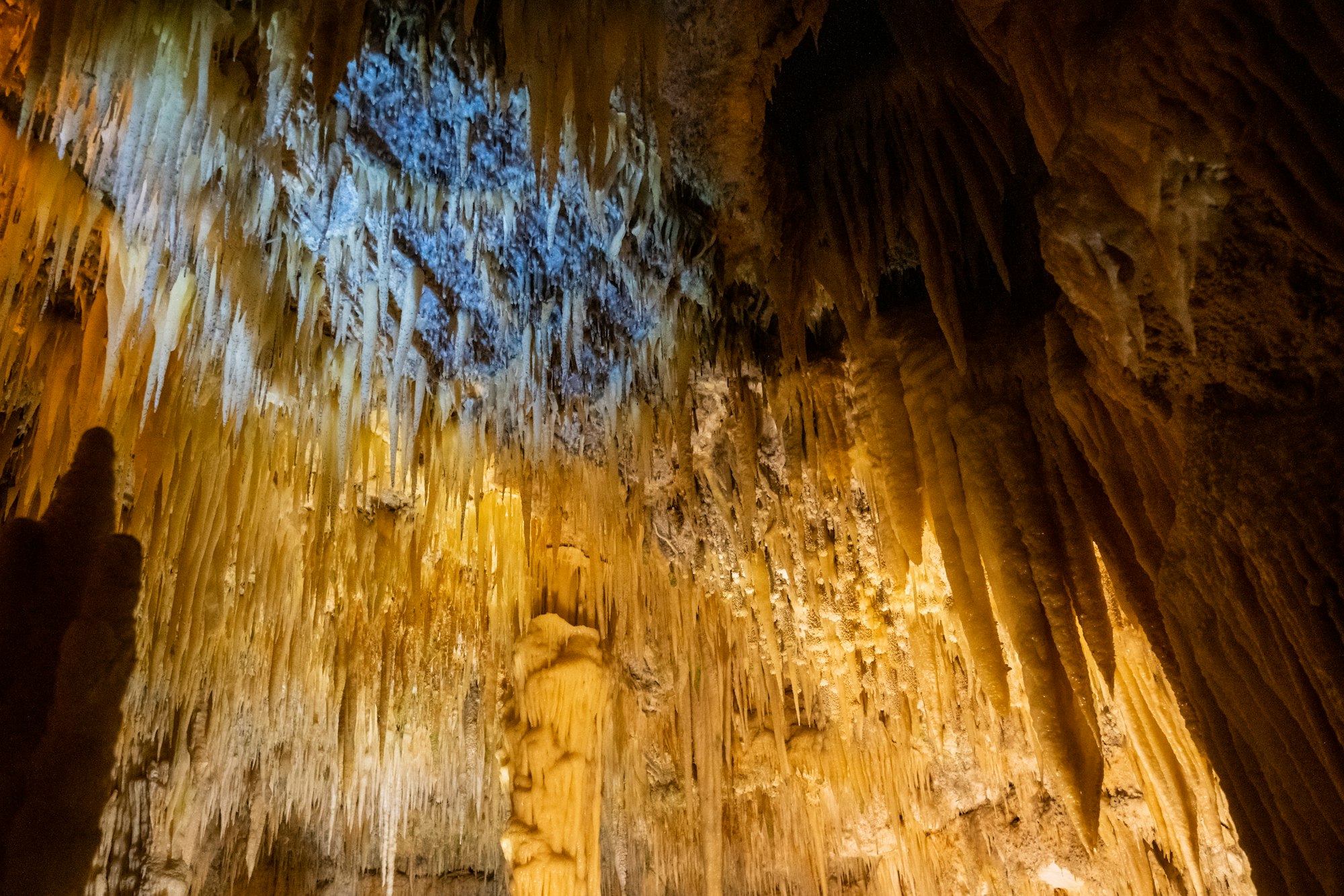 Illuminated stalactites in a limestone cave, like the ringing formations inside Ugong Rock Puerto Princesa